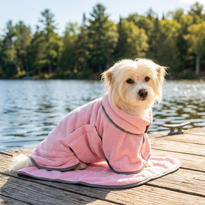 Dog in the Shell Pink Dockside Dry robe on a lakeside dock after a swim